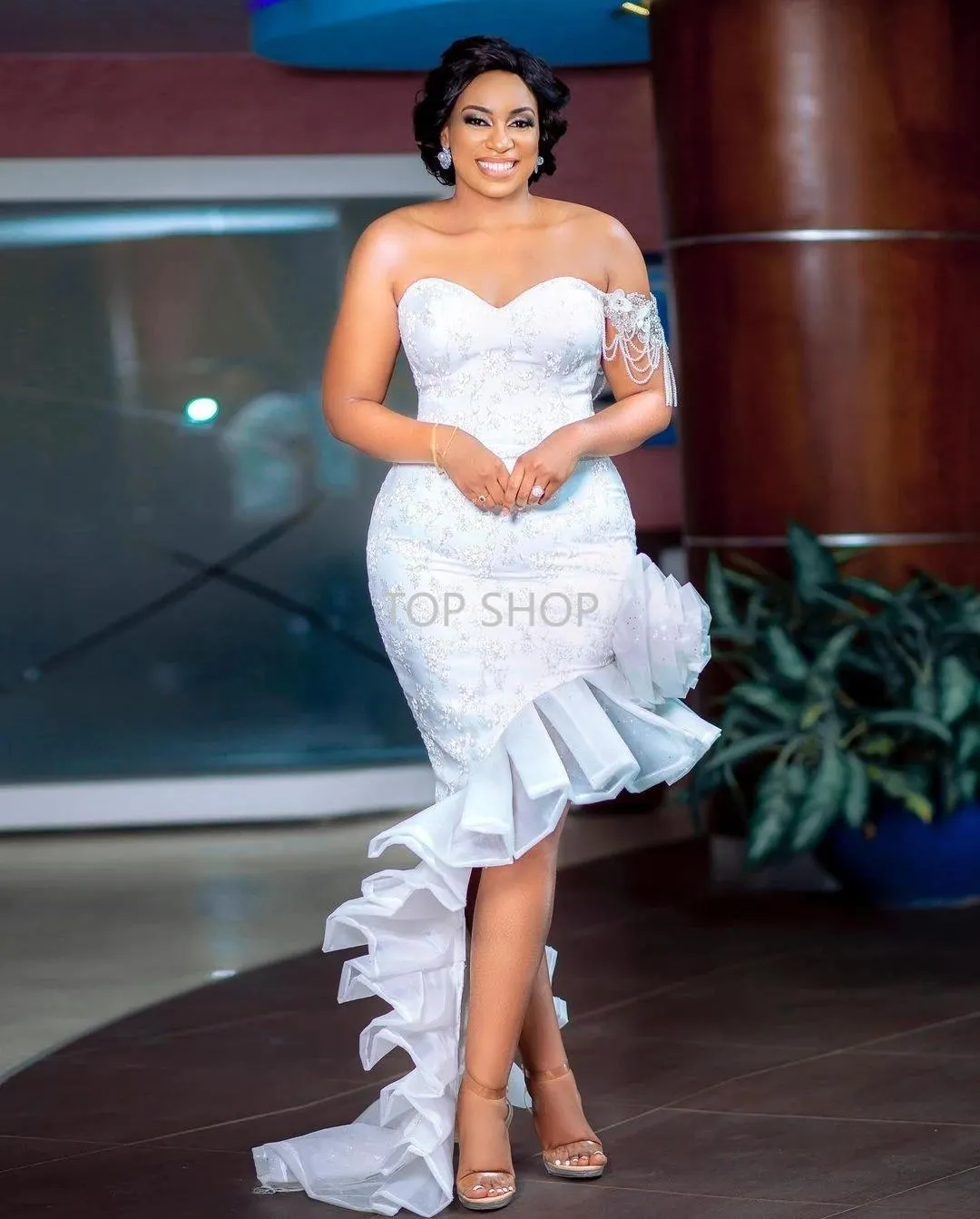 White dress with tassels on sleeves hotsell