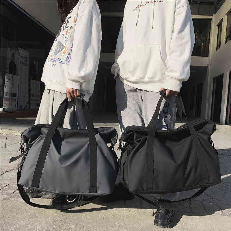 Bolsas de lona Diseñador Fitness Travel Tote Moda de gran capacidad Bolsas de viaje Hombres Simple Negro Deportes Mujer Hombro Equipaje 220626