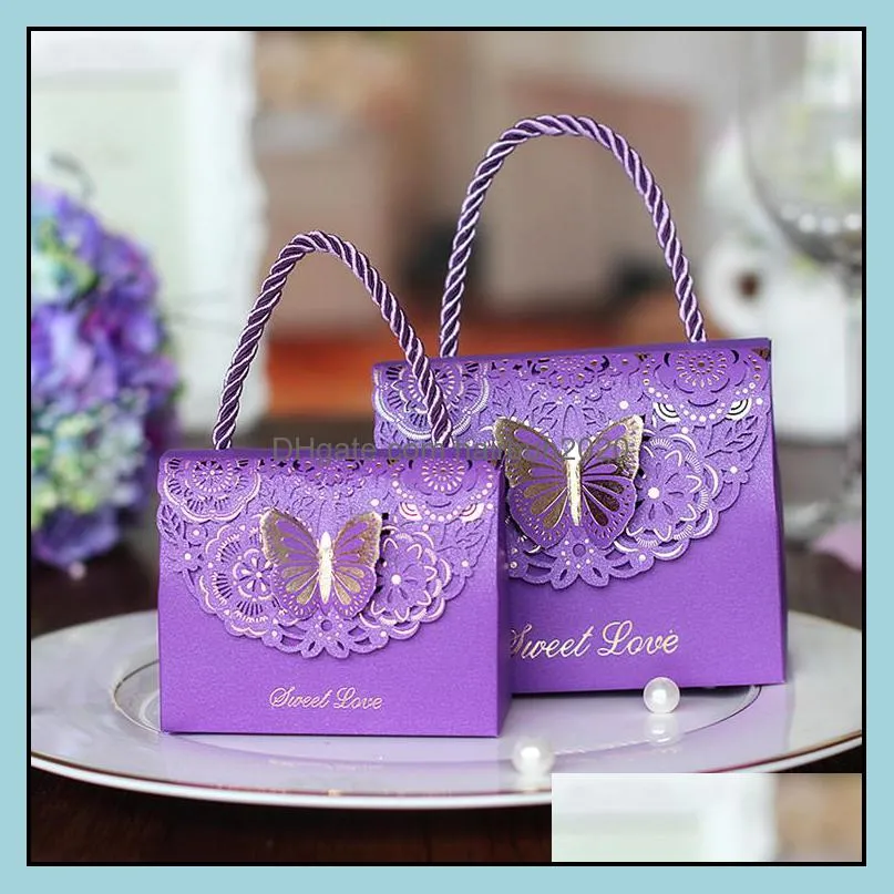 Candy packaging boxes with handle Lovely small paper bags 3D butterfly emboss Paper boxes for wedding gift sweets hollow out design