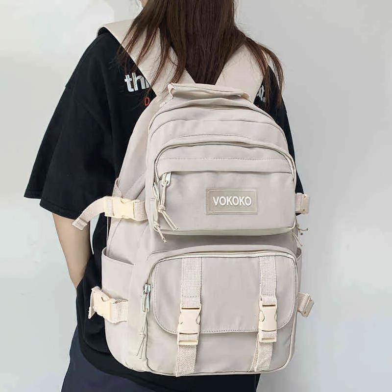 Mochila Backpack estilo novo nylon à prova d'água de bolso de grande capacidade Mulheres de cor sólida Mulheres bolsas de escola inserir laptop de fivela 220723