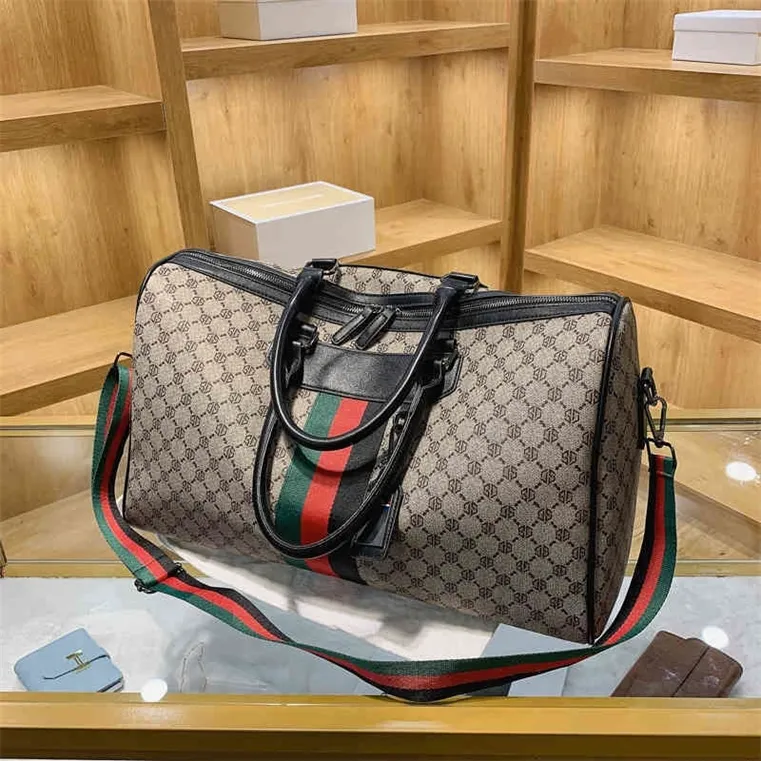 Borsa firmata Liquidazione 60% di sconto sulla borsa Fashion Tote Travel Uomo / Donna Borse a tracolla maschili in pelle Business Bagagli in rilievo