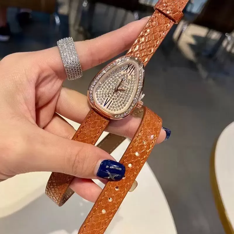 Europe et États-Unis marque de mode populaire montres femmes fille cristal tête de serpent style bracelet en cuir montre-bracelet à quartz B08