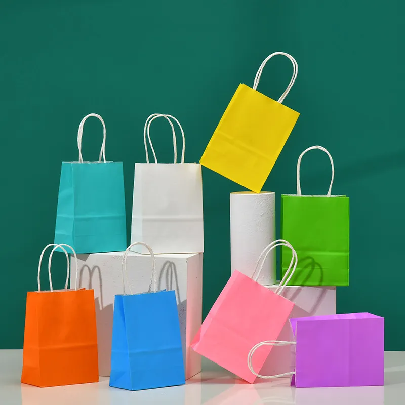 50pcs Lot Color Color Kraft Paper Bag مع مقابض 21 × 11x27cm 27 سم.