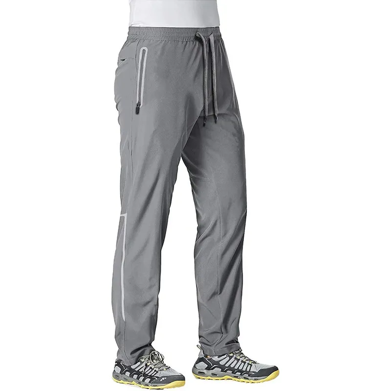 MAGCOMSEN Summer Quick Dry Sweatpants Mens Joggers Pants Reflective Stripe  Zip Pocket Tracksuit Trousers Fitness Training 220509 From Dou02, $18
