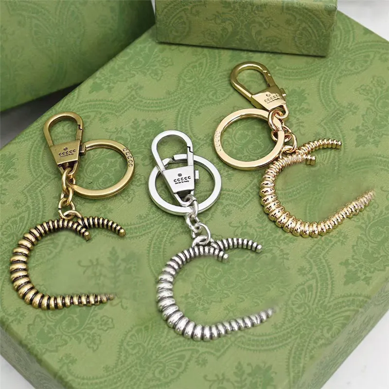 Nyckelringar Lanyards Nyckelring för kvinnor Män Mode Nyckelring Silver Guld Spänne Rostfritt stål Designer Högkvalitativ Drive Key Ring med grön låda