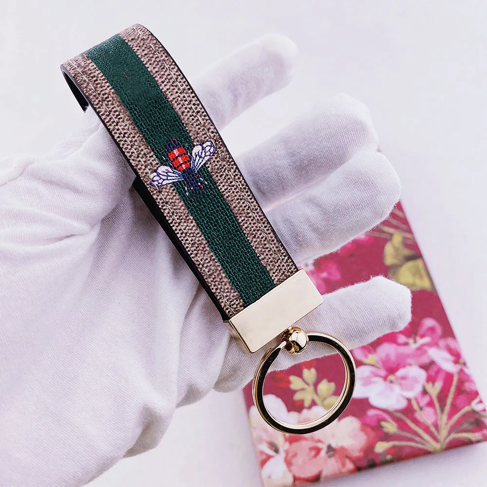 Keychain de designer Chave de fivela de fivela dos amantes da marca de couro feita à mão Flores coloridas de abelha -cobra Saco de Moda Pingente Acessórios de Moda