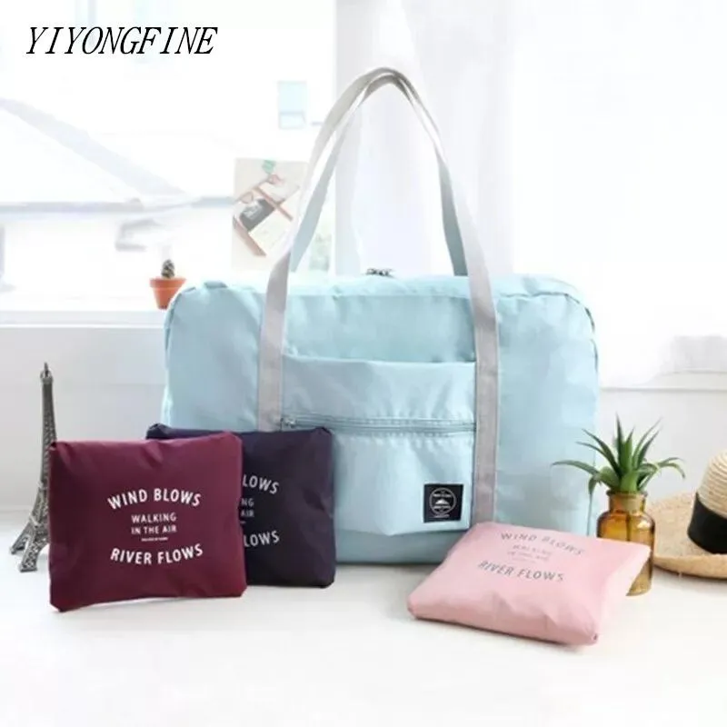 Borsoni da viaggio pieghevoli in nylon Borsa da viaggio per uomo e donna di grande capacità Bagagli da donna Borse impermeabili Cubo di imballaggio per abbigliamento