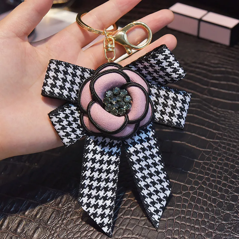 Märke smycken kamellia nyckelring ring strass blomma bowknot pendelle dekoration charms nyckel kedja hållare modedesign webbing bil nyckelringar för kvinnliga gåvor