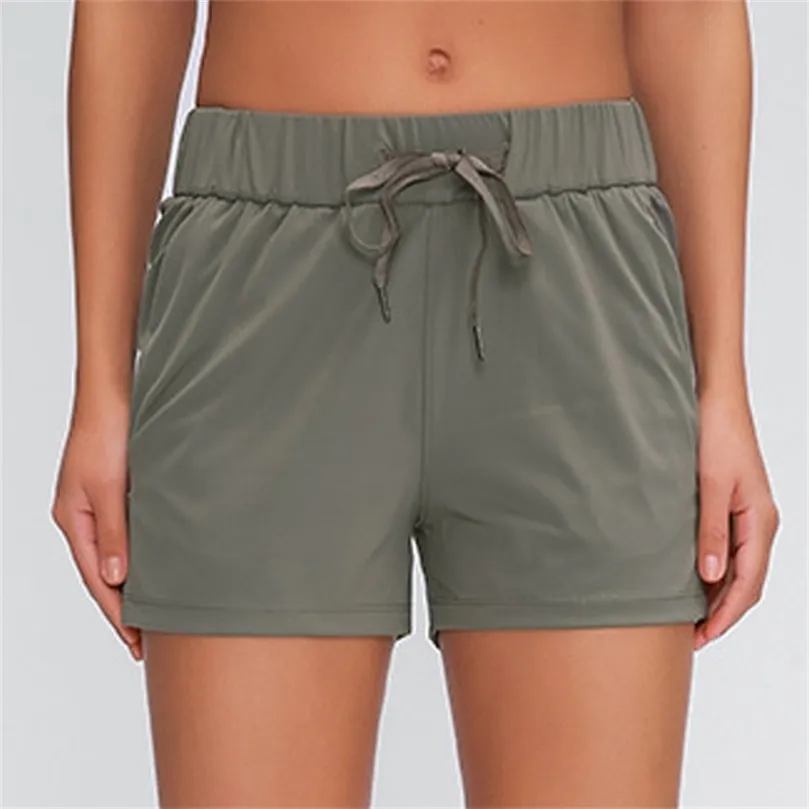 Shorts för kvinnor med fickor Träning som kör sport shorts 4 vägs stretch tyg kort 210301