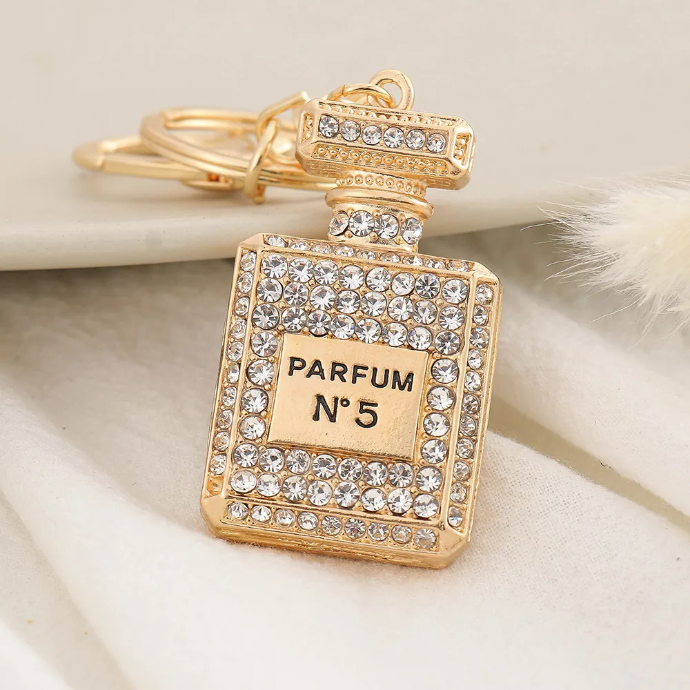 Cristal bouteille de parfum porte-clés pour femmes créatif diamant arc  métal porte-clés voiture sac pendentif petit cadeau bijoux accessoires