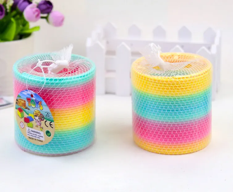 Popular children's Slinky toys small wholesale early education colorful rainbow circle folding music Lala coil magic performance props