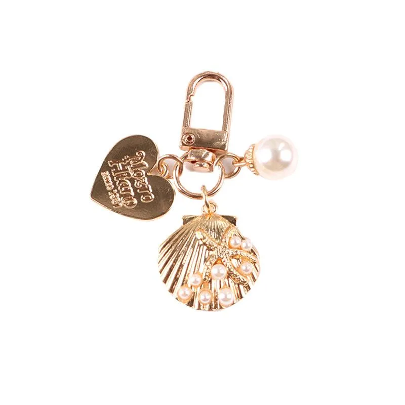 Nyckelringar härliga söta imiterade pärlor hjärta havsstjärna nyckelring metall skal hängande bil nyckelring kvinnor headset case prydnad tillbehör