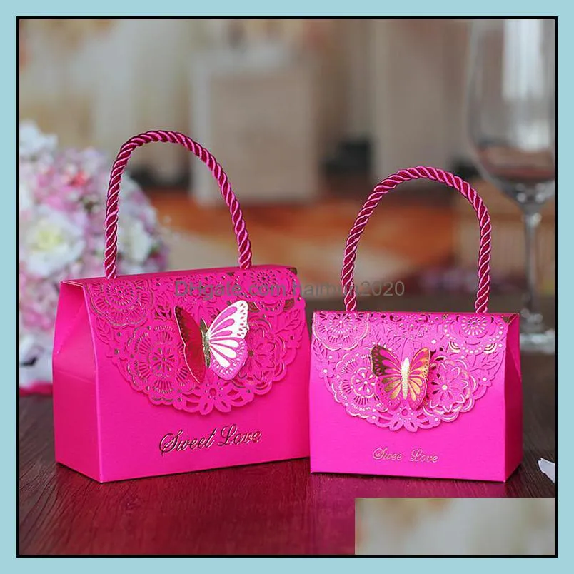 Candy packaging boxes with handle Lovely small paper bags 3D butterfly emboss Paper boxes for wedding gift sweets hollow out design