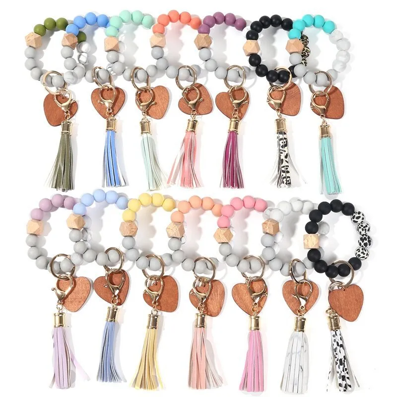 Porte-clés de poignet en perles de Silicone, pompon en cuir PU avec porte-clés en bois en forme de cœur, nouvelle collection