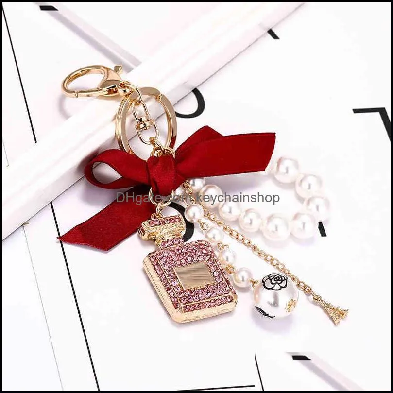 creative handmade diy diamond perfume bottle accessories alloy bow pearl luxury keychain purses charm pendant ys068