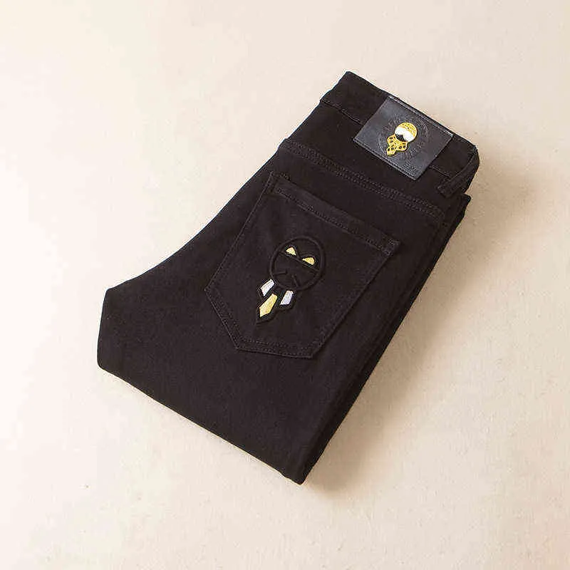 冬の秋のジーンズメンズファッション韓国版スリムフィットスモールフィート弾性汎用ブラックカジュアルパンツ