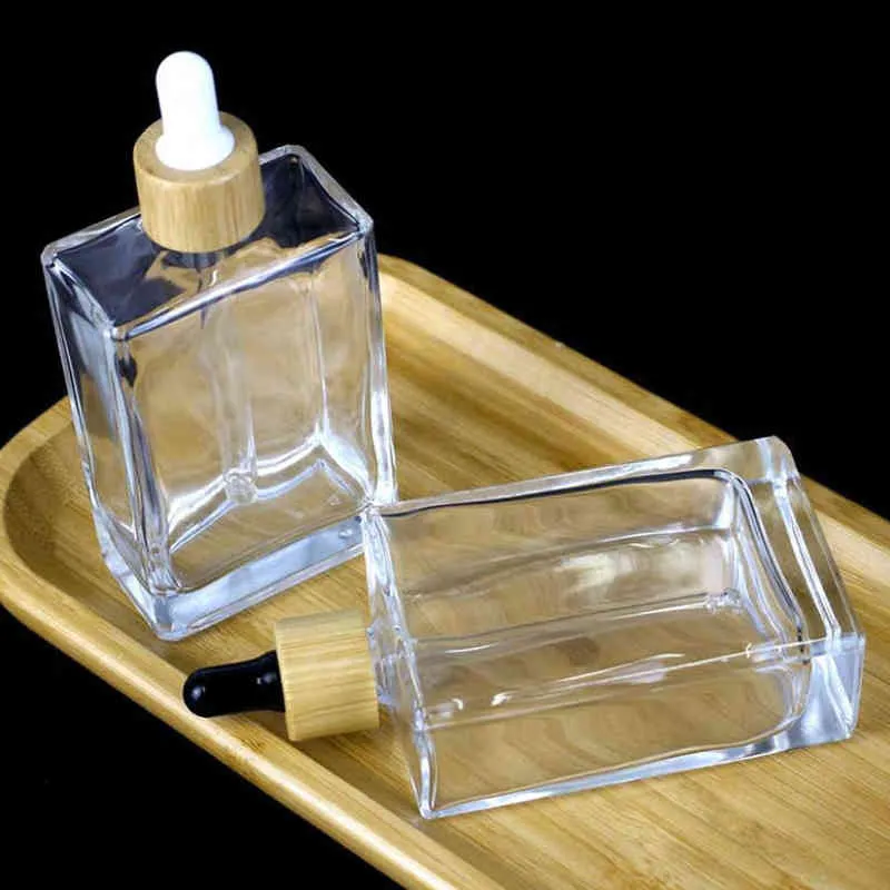 10 pc 100ml Flat Square Glass Tropper Flasche Transparent Glasflasche mit Bambuskappe, goldene Mütze, Roségold -Kappe, schwarze Mütze Y220428