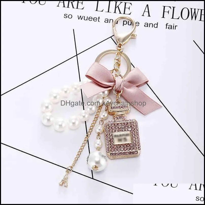 creative handmade diy diamond perfume bottle accessories alloy bow pearl luxury keychain purses charm pendant ys068