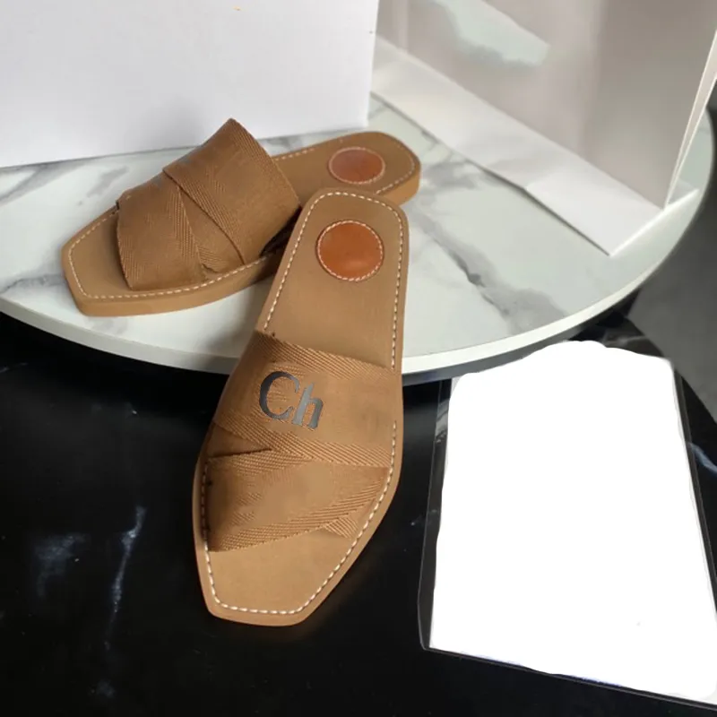 Zomerontwerper sandalen houtachtige muilezel plat sandaal voor vrouw strand slipper luxueuze schoenen canvas damesglaasjes zwart wit bruin zomerschoen