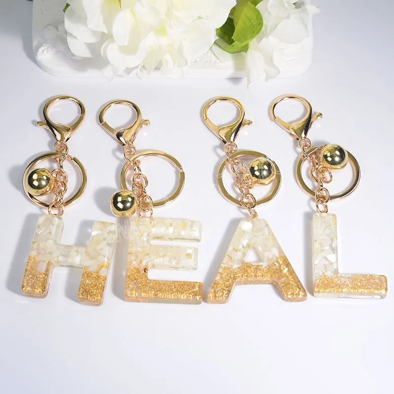 Modeguldf￤rg A-Z Initialer Nyckelring med Bell Glitter 26 Engelska bokst￤ver Pendant Keychains
