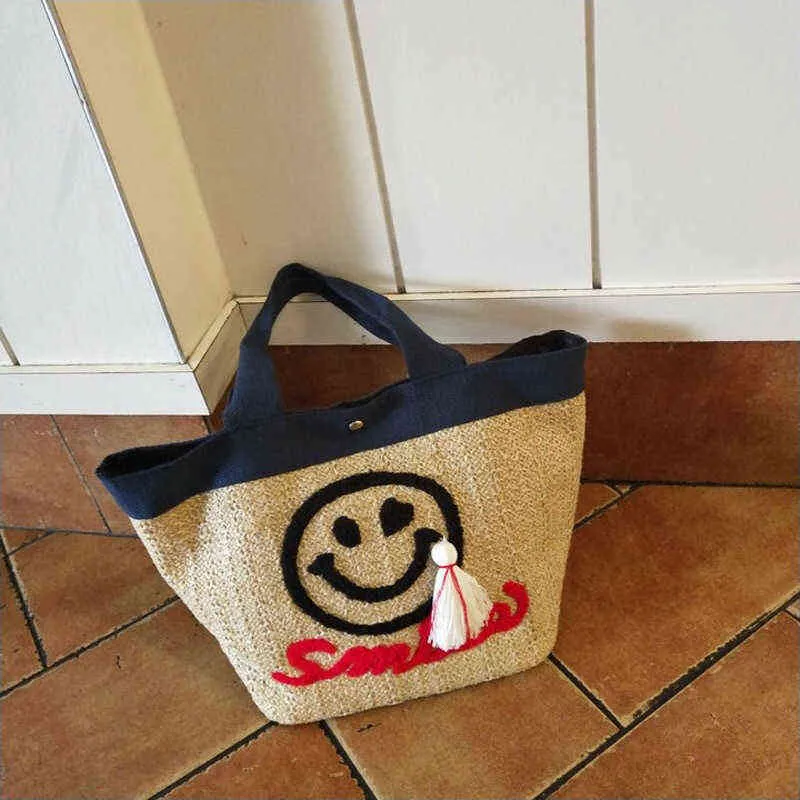 New Korean Ins Straw Woven Bag Cute Embroidered Smiling Face Beach Bag Seaside Holiday Tassel Handbag 220614