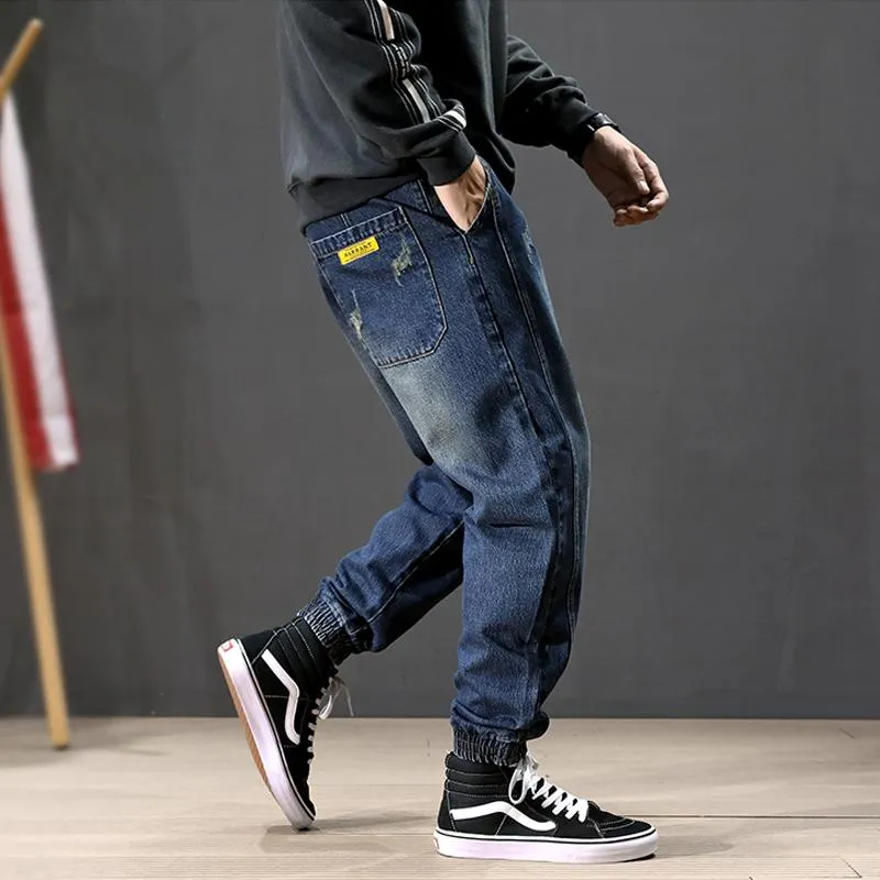 Jeans masculinos Moda de streetwears soltos Fit Spliced ​​Designer Cargo Pants Harem Slack Bottom Hip Hop Ripped Joggersmen's