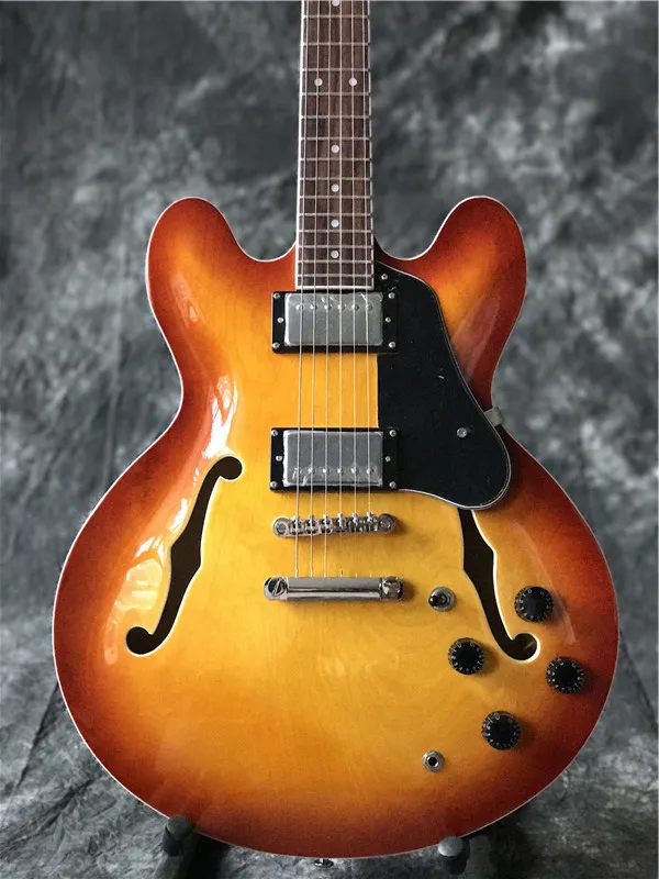 New arrival high quality jazz electric guitar in cherry burst with chrome hardware , with f holes guitarra