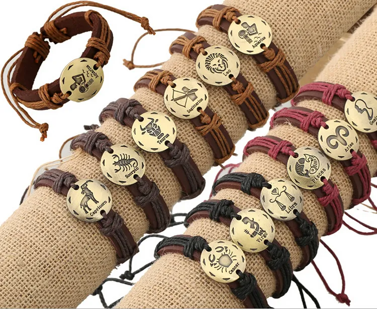 Prezzo all'ingrosso! Mix vendita moda personalizzata fatta a mano stile punk metallo braccialetto in pelle con corda con logo zodiacale per gioielli unisex