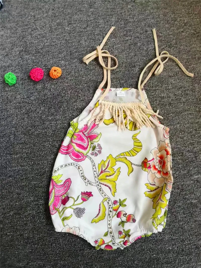 Baby Clothes Summer Toddler Spädbarn Baby Girl Romper SleAlveless Flower Romper Belt Tassel Jumpsuit Outfits Sunsuit Beach Kläder Toppkvalitet