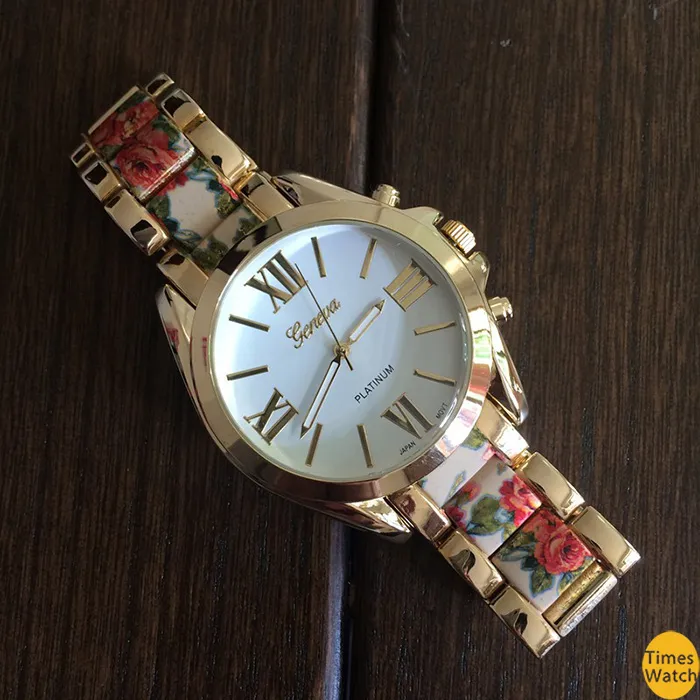 Radiating Roman numerals exude high style on a pretty bracelet watch and finished with a vintage floral print center links. Feel beautiful e