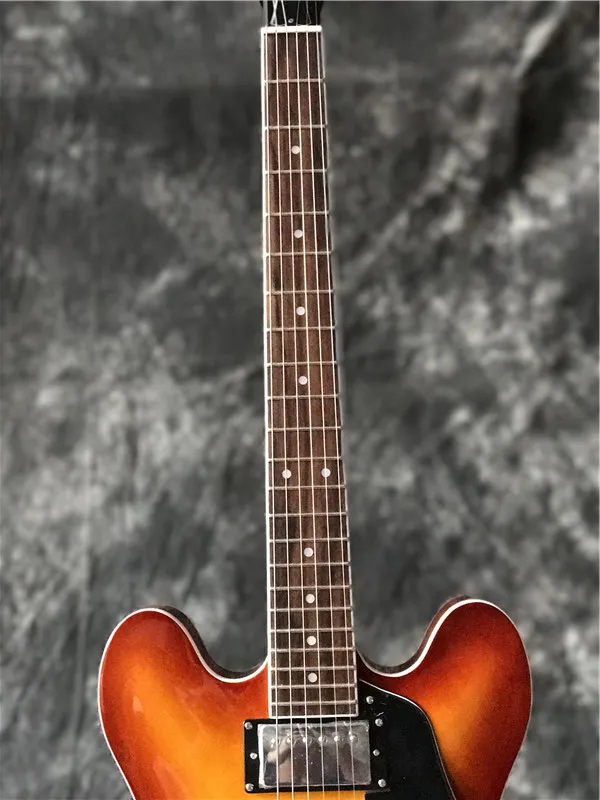 New arrival high quality jazz electric guitar in cherry burst with chrome hardware , with f holes guitarra