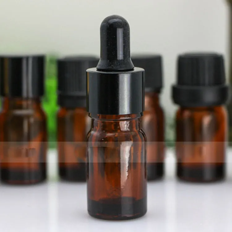 Venta caliente 5ml Mini botellas de vidrio Botella de aceite esencial Tubos de muestra de perfume Viales cuentagotas de vidrio puro ámbar 5CC con 7 tapas para elegir