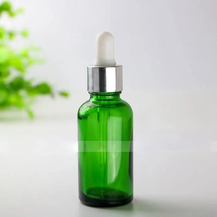 Vente chaude 30ml bouteilles en verre vert avec bouchon à l'épreuve des enfants bouchons à vis huile essentielle cosmétique vide flacons compte-gouttes en verre 30ml en stock