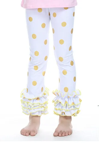 Mädchen-Leggings ohne Fuß mit goldenen Polka Dots und Rüschen. Gold glitzernde Hosen, goldene metallische Polka Dots-Hosen, Rüschen-Leggings für Mädchen