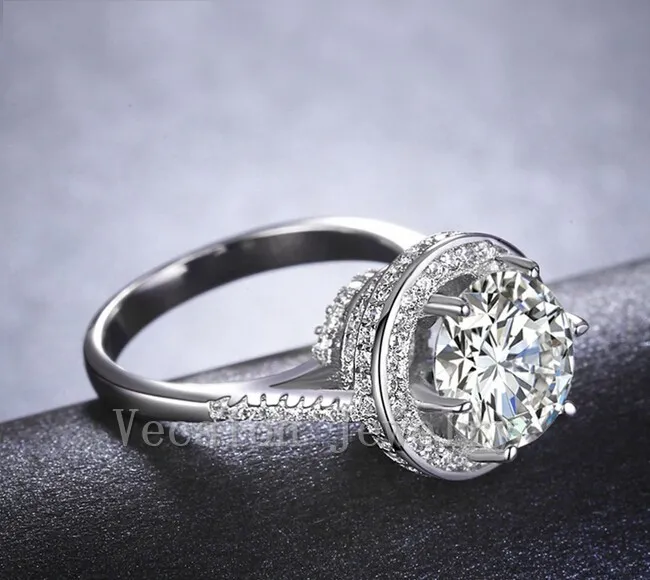 ベカロンクラウンの女性ファッションジュエリーリング4ct CZダイヤモンド925スターリングシルバーの婚約の結婚式のバンドリングのための女性ギフト