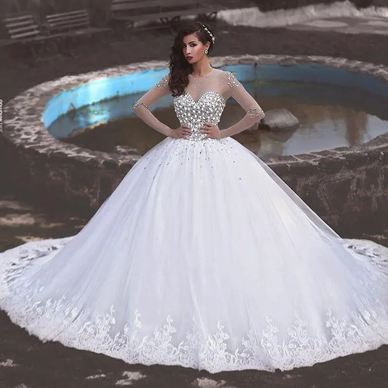 Stunning Crystals Wedding Dress Ball Gown Sheer Jewel Neckline Long Sleeves Beaded Top Tulle Bridal Gowns Lace Appliques Hem