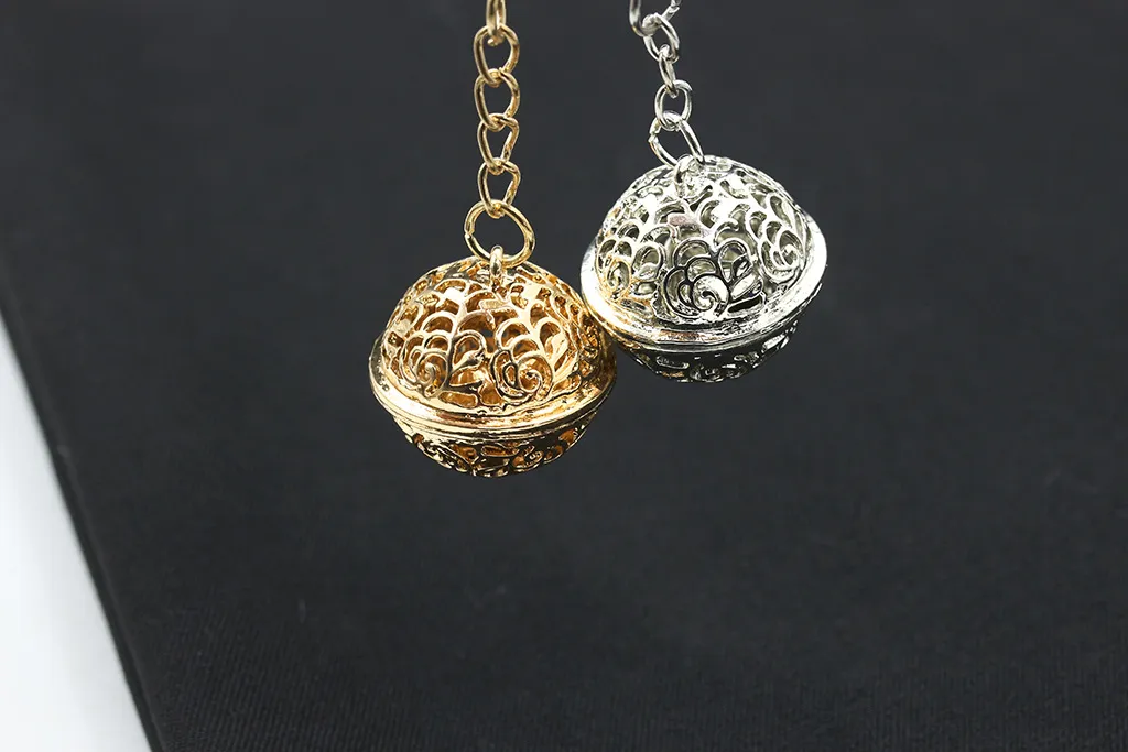 Lyxig guld silver ihålig boll nyckelring stor storlek jingle bell nyckelringar ihåliga blomma legering nyckelringar smycken tillbehör julklapp