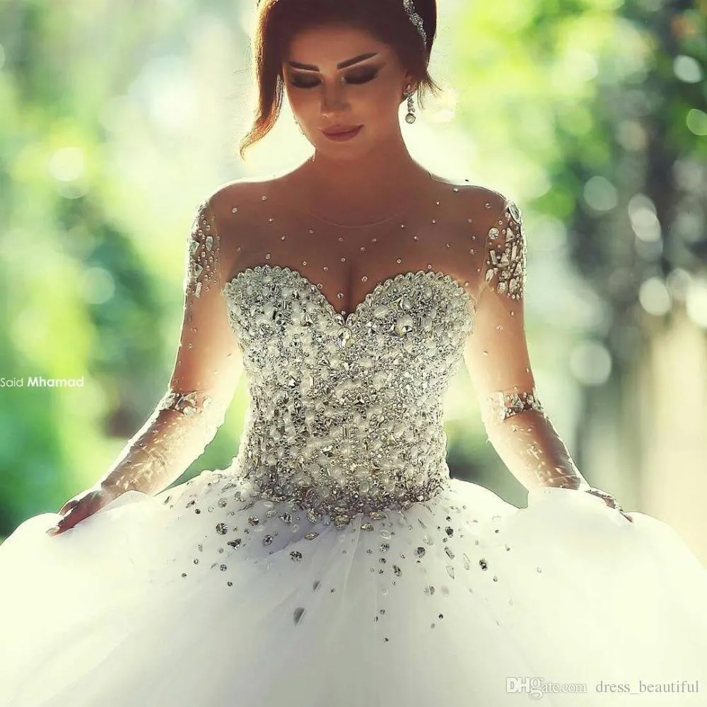 Designer Luxury Crystals Maniche lunghe Abiti da ballo Abiti da sposa Strass Lace-up Indietro Abito da sposa arabo Collo trasparente Vestidos De Novia