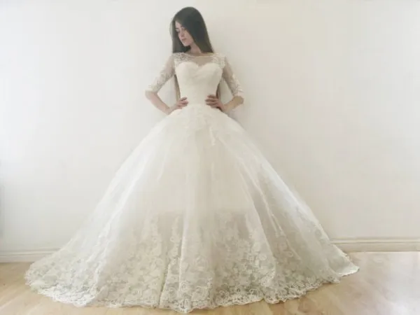 Luxury Puffy A Line Ball Gown Wedding Dress with Sleeves Illusion Bateau Neckline Lace Appliques Zipper Pearls Button Corset Bridal Gowns