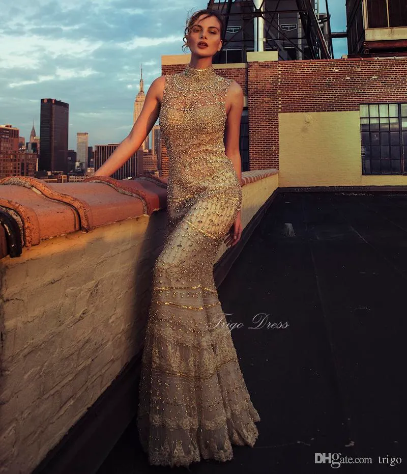2021 Amazing Luxury Gold Beaded Mermaid Evening Gown Designer High Neck Backless Celebrity Party Prom Dresses