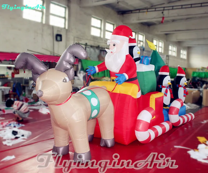 Vente en gros Père Noël gonflable en traîneau de Noël de 6 m avec traîneau à rennes et pingouins