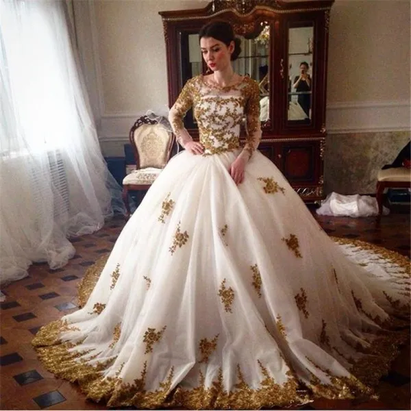 Sparkly Ball Gown Wedding Dresses Beaded Gold Lace Appliques Illusion Long Sleeves Crew Neck Zipper up Back Bridal Gowns with Court Train