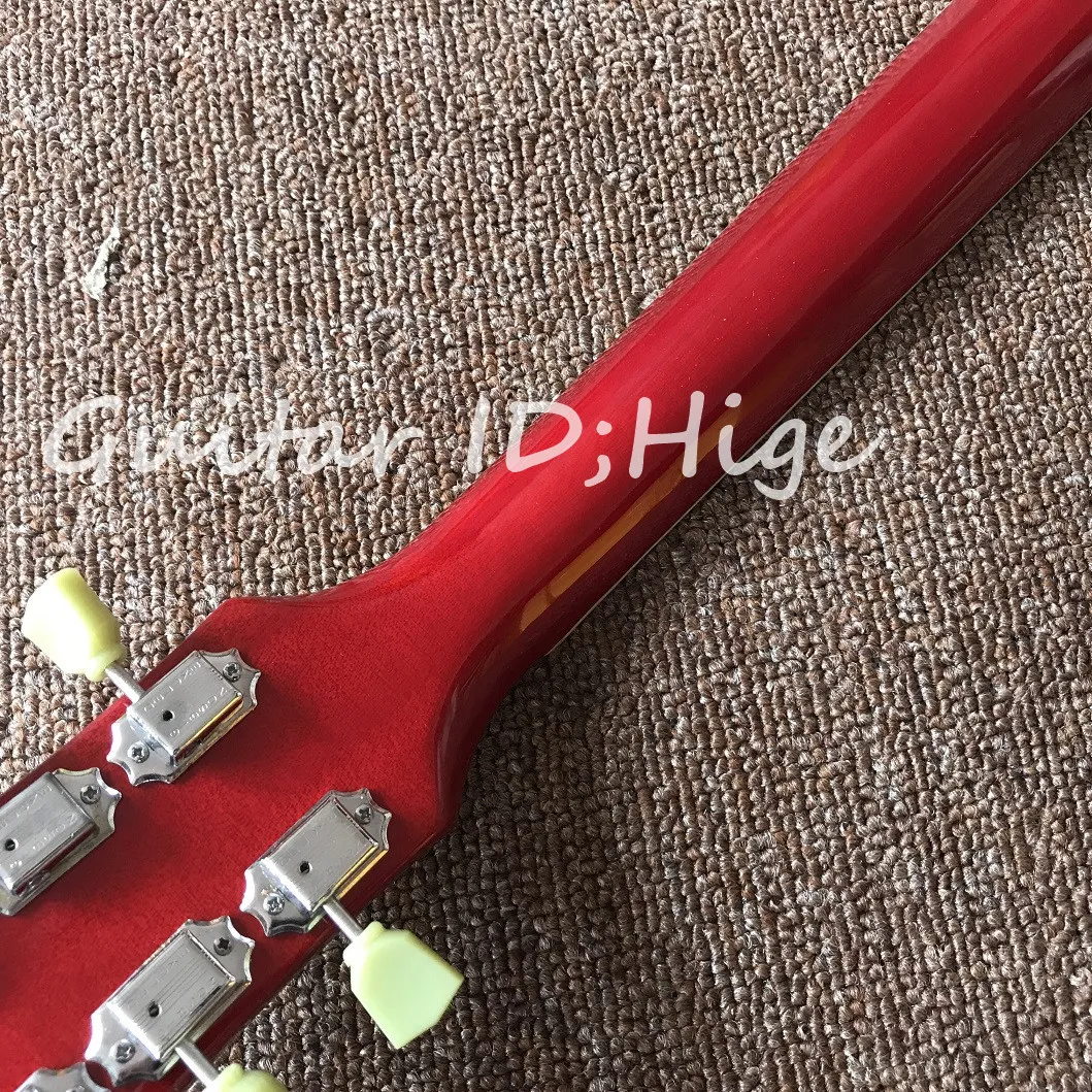 new one piece body and neck electric guiar in red color with ebody fingerboard and frets end binding , with bone nut guitarra