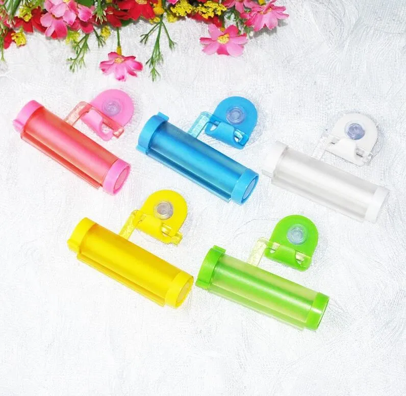 New Colorful Plastic Tube Rolling Toothpaste Squeezer Dispenser Hook Holder Sucker Hanging Bathroom Wall