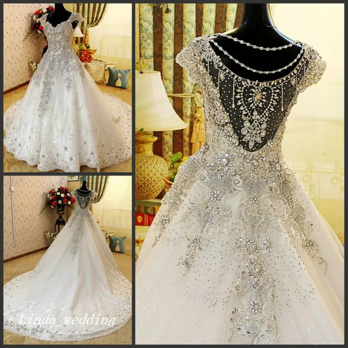 Luxury Crystal Beaded Bröllopsklänningar Romantiskt En Linje Cap Sleeve Tulle Lace Applique Långa Kvinnor Bröllop Party Gowns