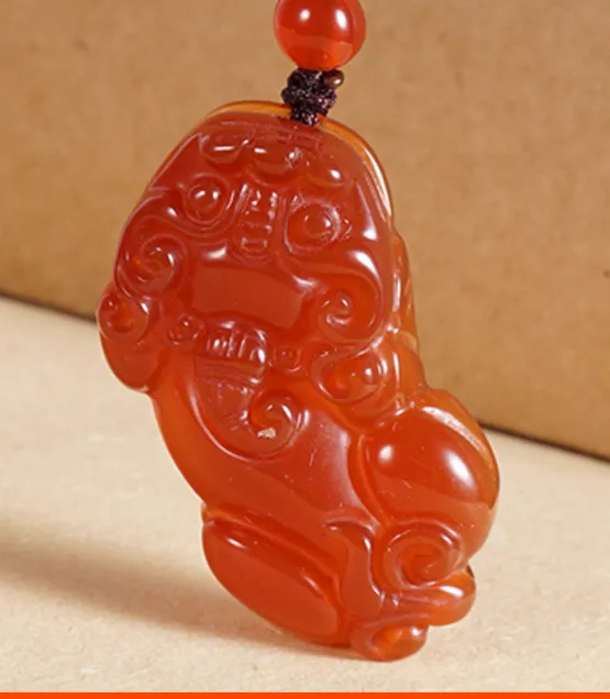 Natural red agate - hand-carved amulet to make a fortune. Pendant necklace pendant