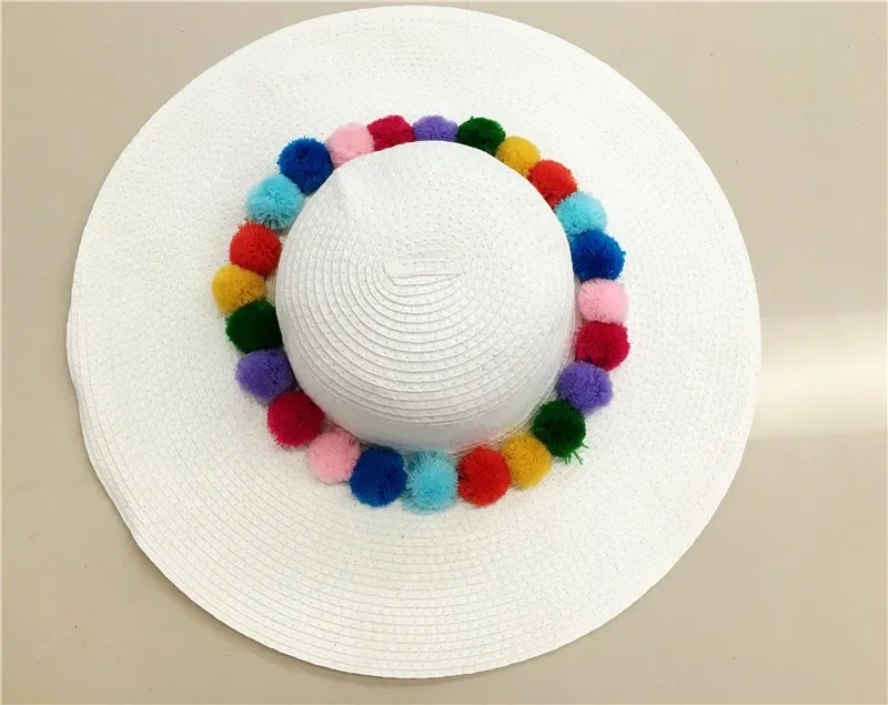 Wide brim sun hat with pom pom sun protection straw beach caps available 