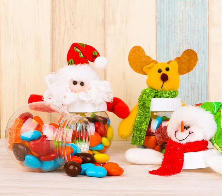 Décorations de Noël 2016. Pot de bonbons cadeau pour les enfants. Le père Noël. Bonhomme de neige. Wapiti. Poupée. Décorations de Noël. Petits articles cadeaux.