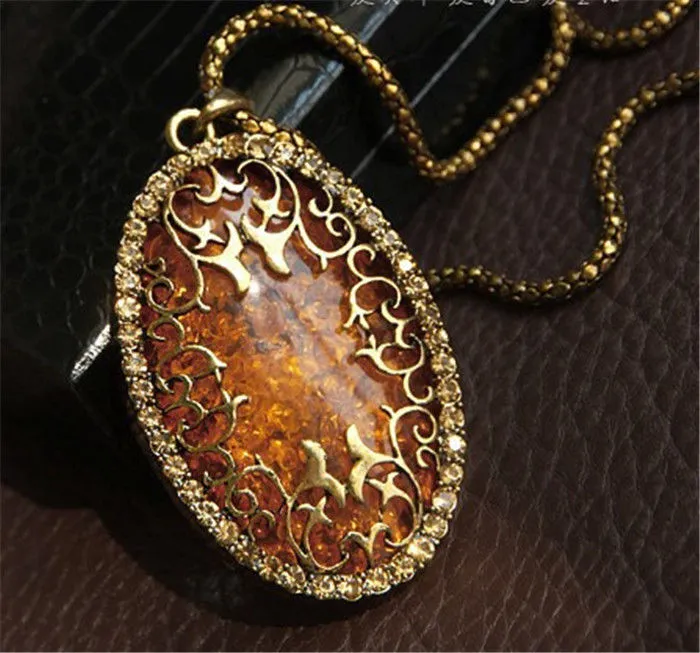 Vintage Womens Amber Hollow Out Rhinestone Oval Długi Łańcuch Naszyjnik Biżuteria Retro Długi Łańcuch Amber Wisiorek Naszyjniki Akcesoria