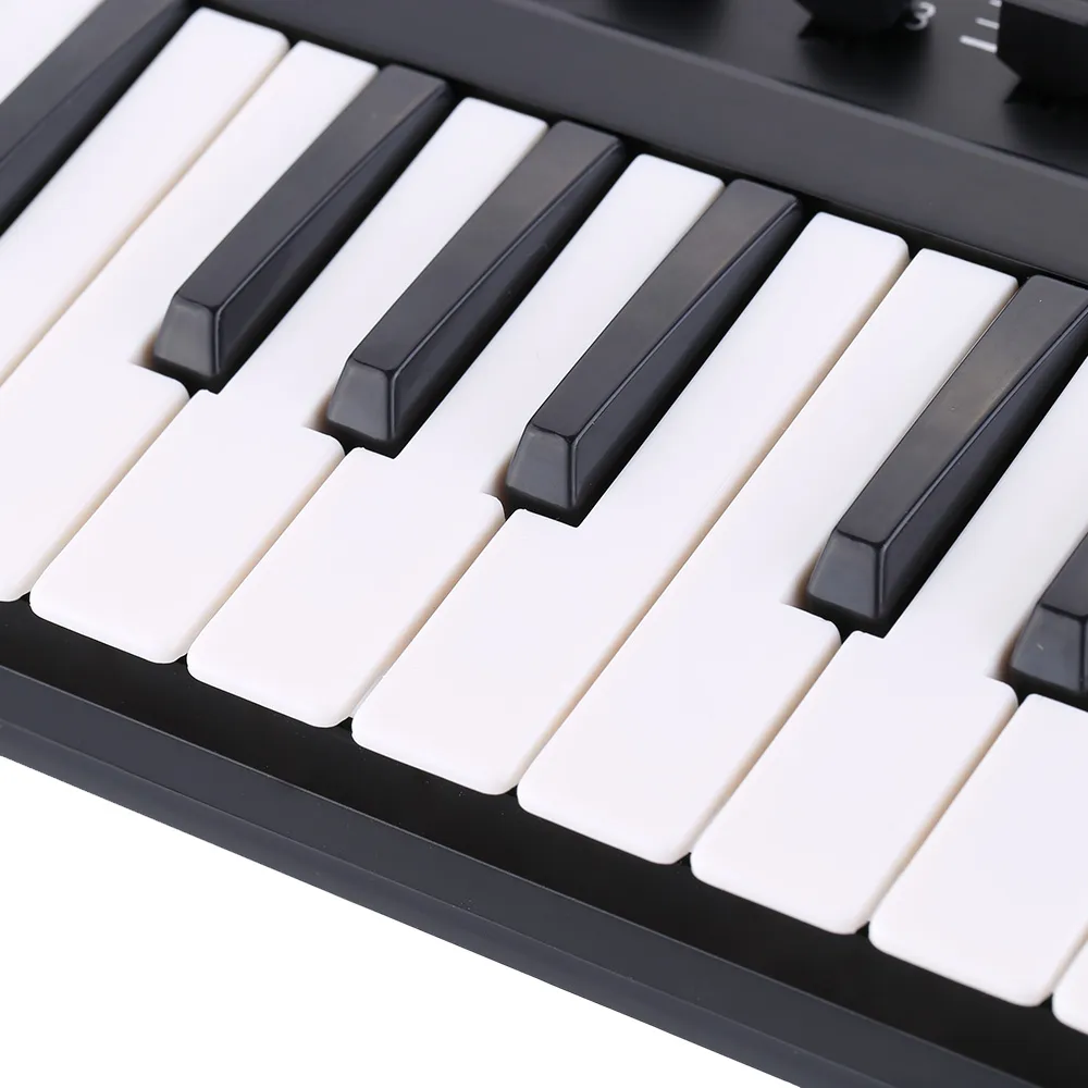 mini Portable Mini 25Key USB Keyboard Controller and Drum Pad MIDI Controller5213320